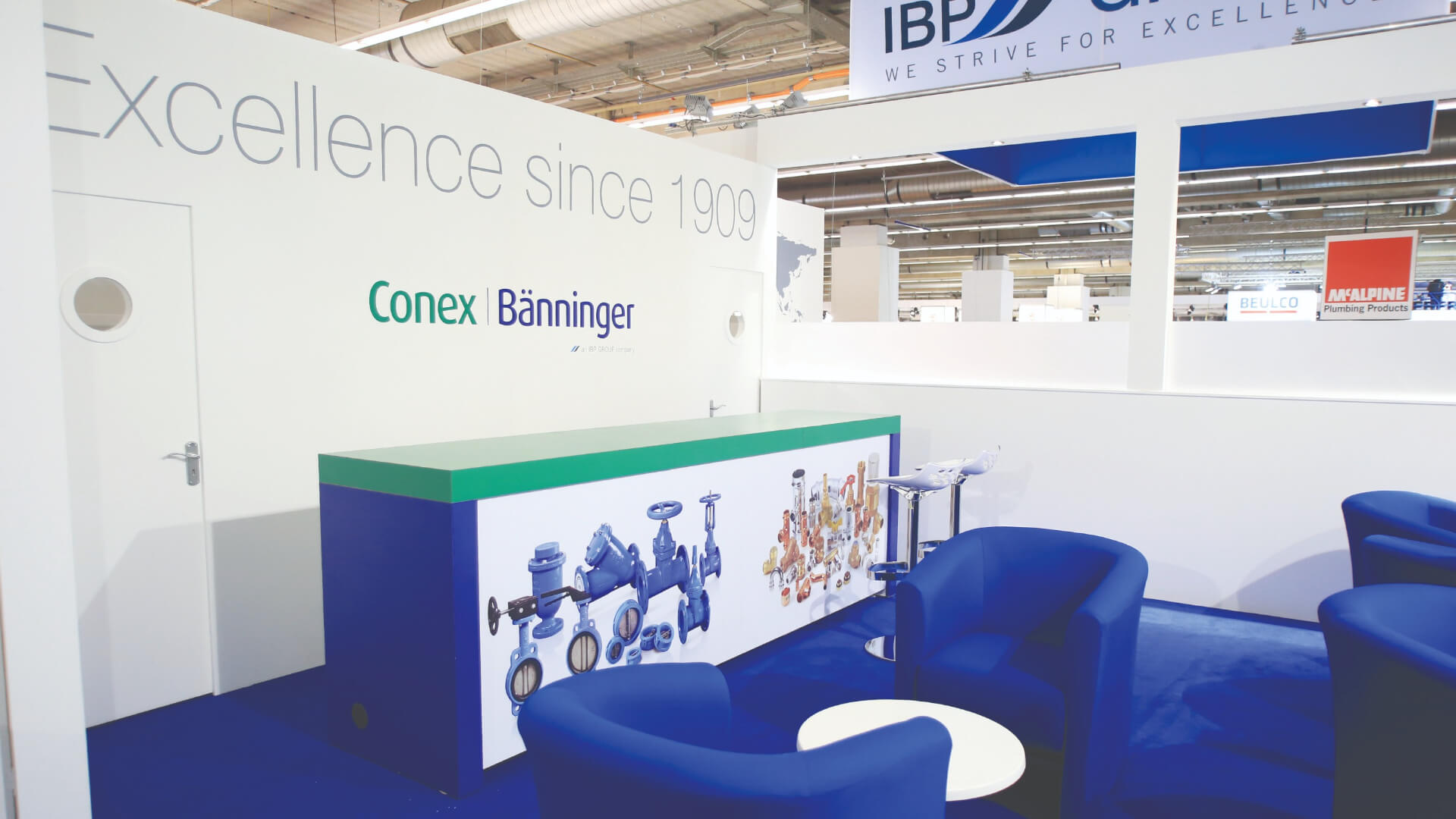 ibp exhibition with a desk and chairs