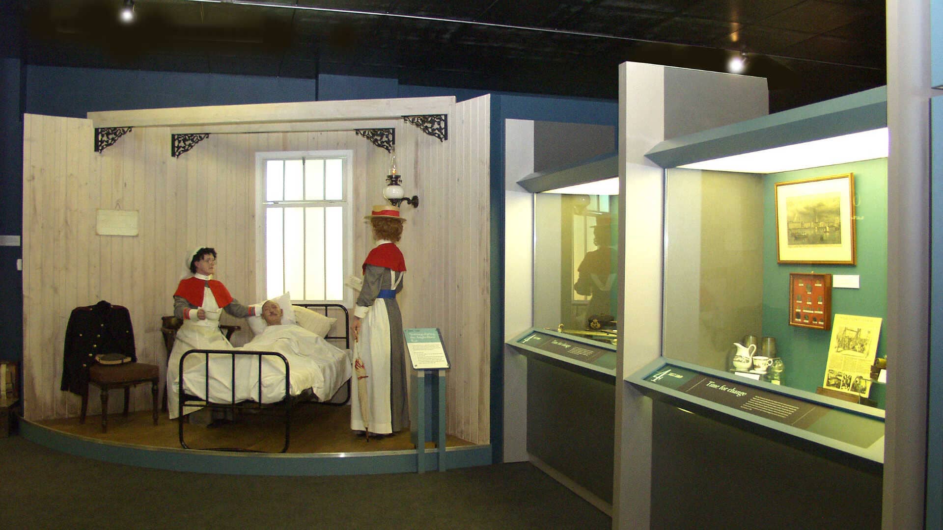 mannequins dressed as nurses next to a display cabinet