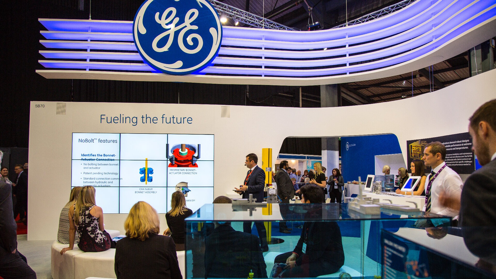 people watching a ge offshore presentation at an exhibition