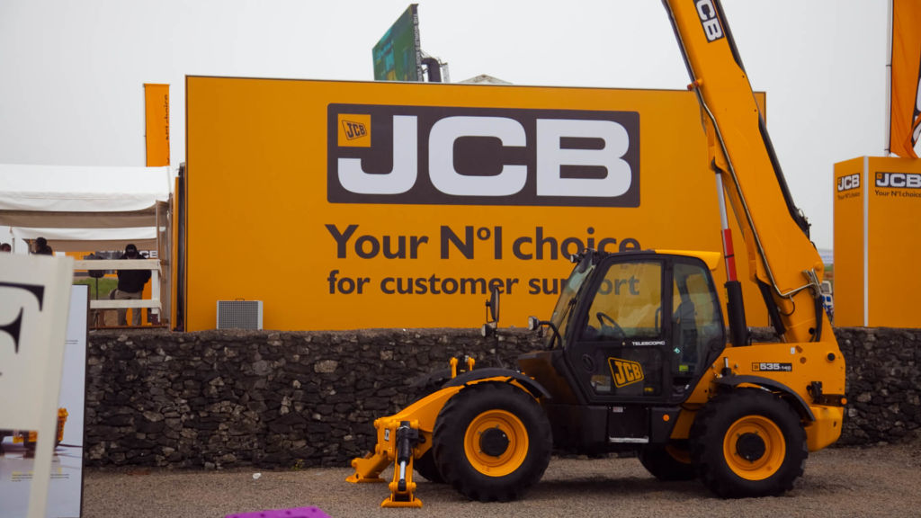 side profile of the jcb exhibition building and a digger