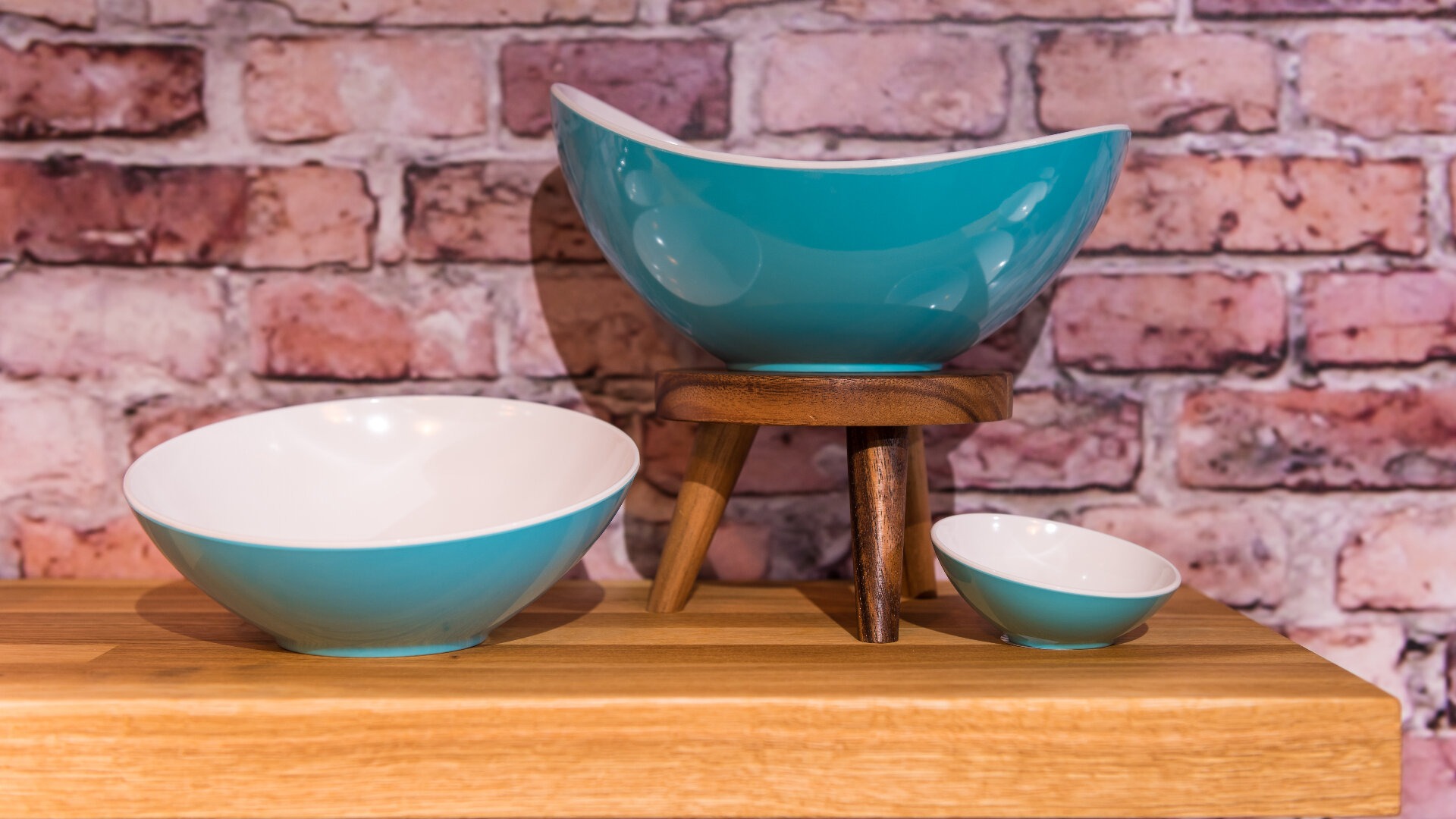 various turquoise bowls displayed on a table