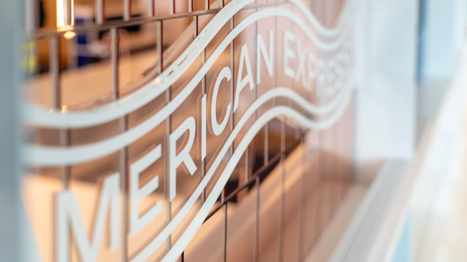 american express logo printed on glass